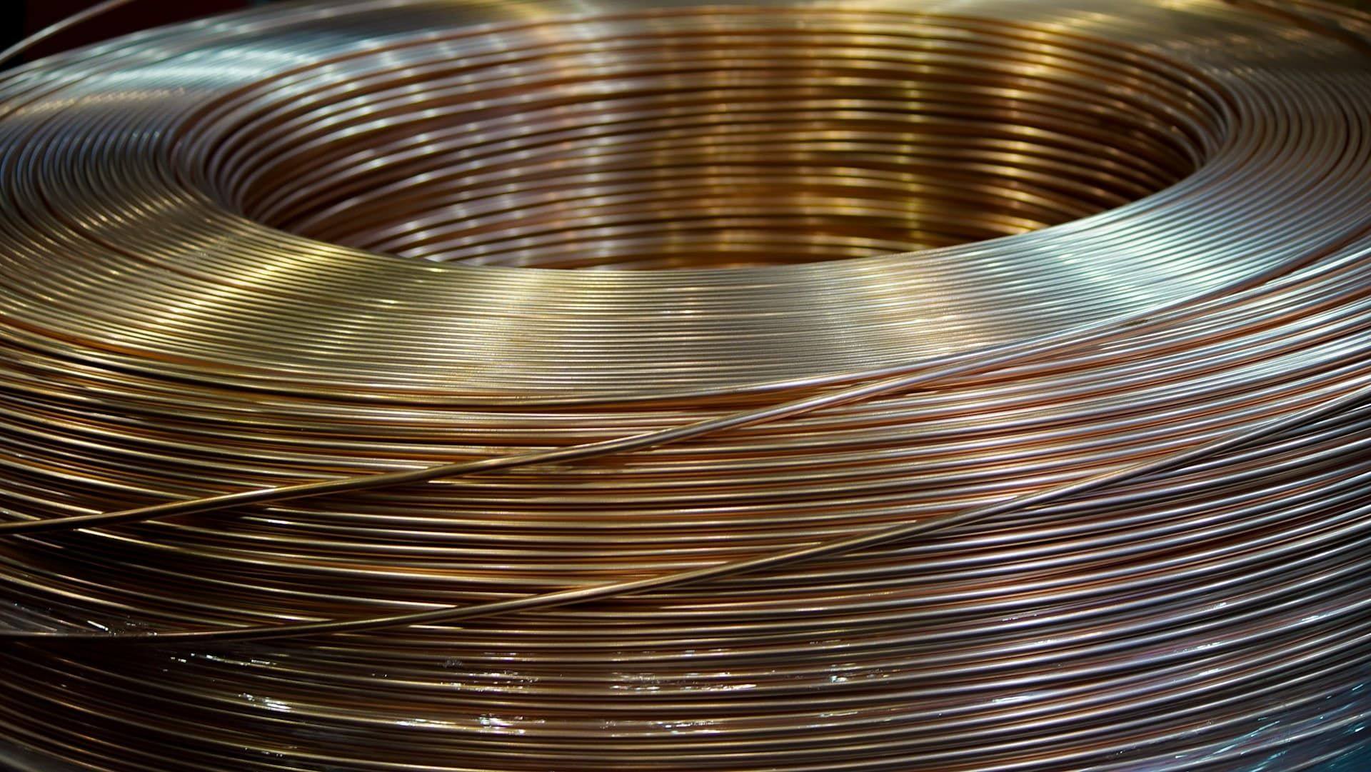 A large coil of bright drawn copper rod